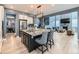 Open-concept kitchen with granite countertops, stainless-steel appliances, and views to the living room at 11657 Olathe St, Commerce City, CO 80022