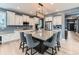 Bright kitchen features granite countertops, stainless steel appliances, and an island with seating at 11657 Olathe St, Commerce City, CO 80022
