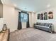 Enjoy a cozy media room with plush carpeting, natural light, and modern decor at 11657 Olathe St, Commerce City, CO 80022