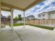 Relax in your covered patio offering an enjoyable view of your spacious yard at 11657 Olathe St, Commerce City, CO 80022