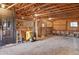 Spacious barn interior with horse stalls, wooden beams, and ample natural light at 12493 Forest Canyon Dr, Parker, CO 80138