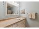 Bathroom with large mirror, white vanity and updated hardware at 12493 Forest Canyon Dr, Parker, CO 80138