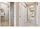 Hallway bathroom with glass-enclosed shower and ample storage at 12493 Forest Canyon Dr, Parker, CO 80138