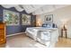 Inviting bedroom with plenty of light, wood floors, and calming accent wall at 12493 Forest Canyon Dr, Parker, CO 80138