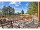 Open air deck overlooking the lush greenery with seating, perfect for relaxation at 12493 Forest Canyon Dr, Parker, CO 80138