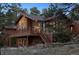 Charming home featuring a balcony, multiple windows and a stone accented facade at 12493 Forest Canyon Dr, Parker, CO 80138