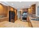 Spacious kitchen featuring stainless steel appliances, wood cabinets, and ample counter space at 12493 Forest Canyon Dr, Parker, CO 80138