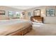 Bright main bedroom with natural light and view of the treed scenery outside the windows at 12493 Forest Canyon Dr, Parker, CO 80138