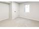 Unfinished basement with neutral paint, carpet, and a window at 315 S Xapary St, Aurora, CO 80012