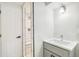 Modern bathroom with tiled shower and updated vanity with sink at 315 S Xapary St, Aurora, CO 80012