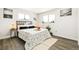 Light filled bedroom with hardwood floors and neutral decor for a relaxing retreat at 315 S Xapary St, Aurora, CO 80012