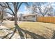 Street view showcasing a charming home with a detached garage, complemented by a well-maintained front yard at 315 S Xapary St, Aurora, CO 80012