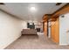 Spacious finished basement featuring a cozy fireplace and comfortable seating area at 3225 W Mexico Ave, Denver, CO 80219