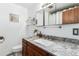 Bathroom featuring a new vanity, large mirror, and modern fixtures at 3225 W Mexico Ave, Denver, CO 80219