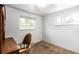 Bedroom featuring carpet, a desk with chair, and two windows allowing for natural light at 3225 W Mexico Ave, Denver, CO 80219