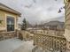 View of the backyard featuring a fence, lawn, and surrounding neighborhood at 424 N De Gaulle Ct, Aurora, CO 80018