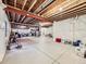 Unfinished basement featuring concrete floor, exposed ceiling, and white plastic sheeting at 424 N De Gaulle Ct, Aurora, CO 80018