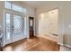 Inviting foyer with gleaming hardwood floors and decorative glass front door at 424 N De Gaulle Ct, Aurora, CO 80018