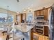 Spacious kitchen with a large center island, stainless steel appliances, and beautiful wood cabinetry at 424 N De Gaulle Ct, Aurora, CO 80018