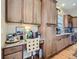 Built-in desk with cabinets in kitchen, providing a functional workspace at 424 N De Gaulle Ct, Aurora, CO 80018