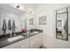 Modern bathroom with double vanity, a shower, and stylish decor at 903 E 13Th Ave, Denver, CO 80218