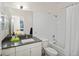 Modern bathroom with a tub, shower, and vanity at 903 E 13Th Ave, Denver, CO 80218