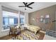 Cozy bedroom with a twin bed, a ceiling fan, and cheerful decor at 903 E 13Th Ave, Denver, CO 80218