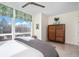 Bright bedroom with large windows, city views and a wooden dresser at 903 E 13Th Ave, Denver, CO 80218