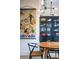 Stylish dining area featuring a wood table, chairs, and a vintage Colorado print at 903 E 13Th Ave, Denver, CO 80218
