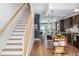 Open concept kitchen with an island and dark cabinetry at 903 E 13Th Ave, Denver, CO 80218