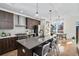 Spacious kitchen featuring modern cabinetry, stainless steel appliances, and an island at 903 E 13Th Ave, Denver, CO 80218