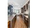 Open concept kitchen with island and stainless steel appliances, overlooking living room at 903 E 13Th Ave, Denver, CO 80218