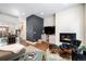 Bright living room features a fireplace, large TV, and comfortable seating at 903 E 13Th Ave, Denver, CO 80218