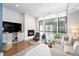 Comfortable living room with a fireplace, large windows, and a sectional sofa at 903 E 13Th Ave, Denver, CO 80218