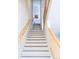 Modern staircase with light wood railings and white risers at 903 E 13Th Ave, Denver, CO 80218