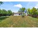 Large backyard featuring a well-maintained lawn and mature trees at 272 Lafayette St, Louisville, CO 80027