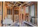 Partially finished basement with exposed pipes and a utility sink at 272 Lafayette St, Louisville, CO 80027