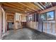 Unfinished basement with exposed wood beams and stairs at 272 Lafayette St, Louisville, CO 80027