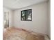 Bright bedroom featuring a window and hardwood floor at 272 Lafayette St, Louisville, CO 80027