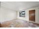 Spacious living room with a large window and hardwood floors at 272 Lafayette St, Louisville, CO 80027