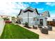 Spacious backyard with a patio, grass lawn, and an entrance to the property at 1019 26Th St, Denver, CO 80205