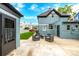 Inviting backyard patio with stylish seating, perfect for outdoor relaxation and entertaining, with small patch of grass at 1019 26Th St, Denver, CO 80205