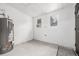 The basement has neutral walls, two windows, and a cement floor at 1019 26Th St, Denver, CO 80205