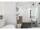 Elegant bathroom with glass-enclosed shower, modern fixtures, and stylish tile flooring at 1019 26Th St, Denver, CO 80205