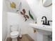 Unique bathroom with decorative wall art, pedestal sink, and modern fixtures at 1019 26Th St, Denver, CO 80205