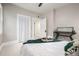 Bedroom view highlights the neutral colors and opens to a hallway and bathroom at 1019 26Th St, Denver, CO 80205