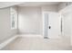 Bright bedroom with a window, closet, neutral walls and carpeted floors at 1019 26Th St, Denver, CO 80205