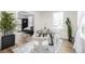 Light and airy dining area features an elegant round table and seamless access to other rooms at 1019 26Th St, Denver, CO 80205