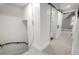 Bright hallway with fresh paint, leading to a bathroom with sliding door at 1019 26Th St, Denver, CO 80205