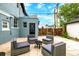 Outdoor patio with four cushioned chairs around a small metal table at 1019 26Th St, Denver, CO 80205